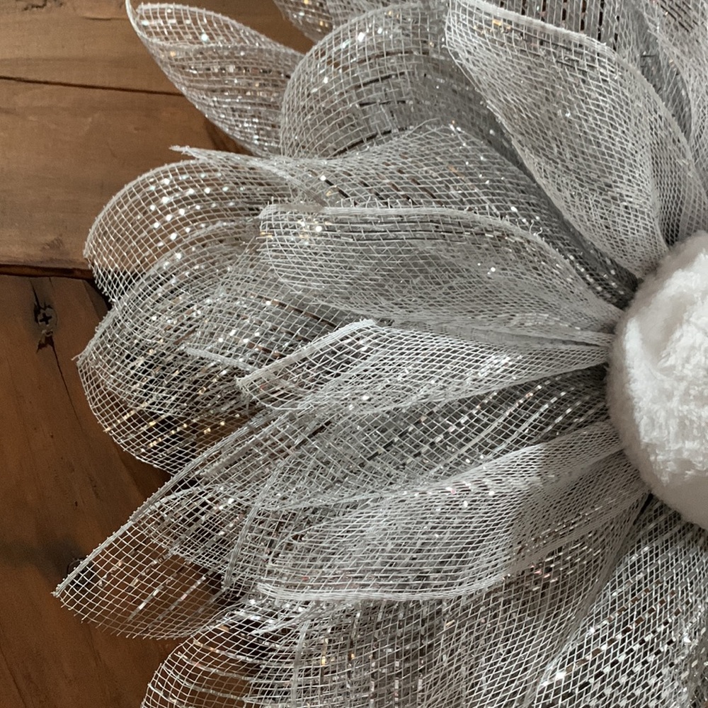 This snowy, wintery looking flower wreath is around 16”. - Picture 3 of 6